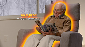 Senior man sitting on a recliner reading a magazine
